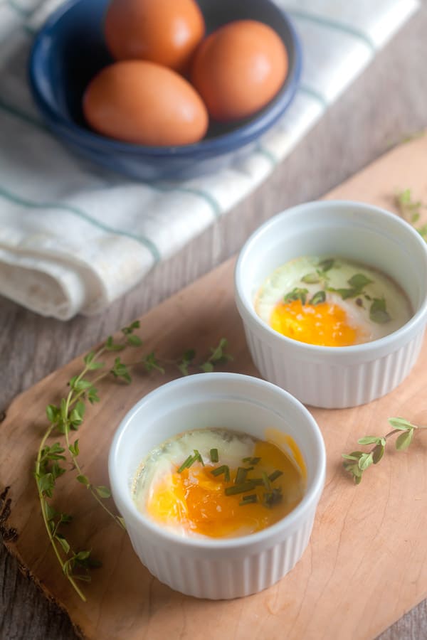 Two ramekins with baked eggs