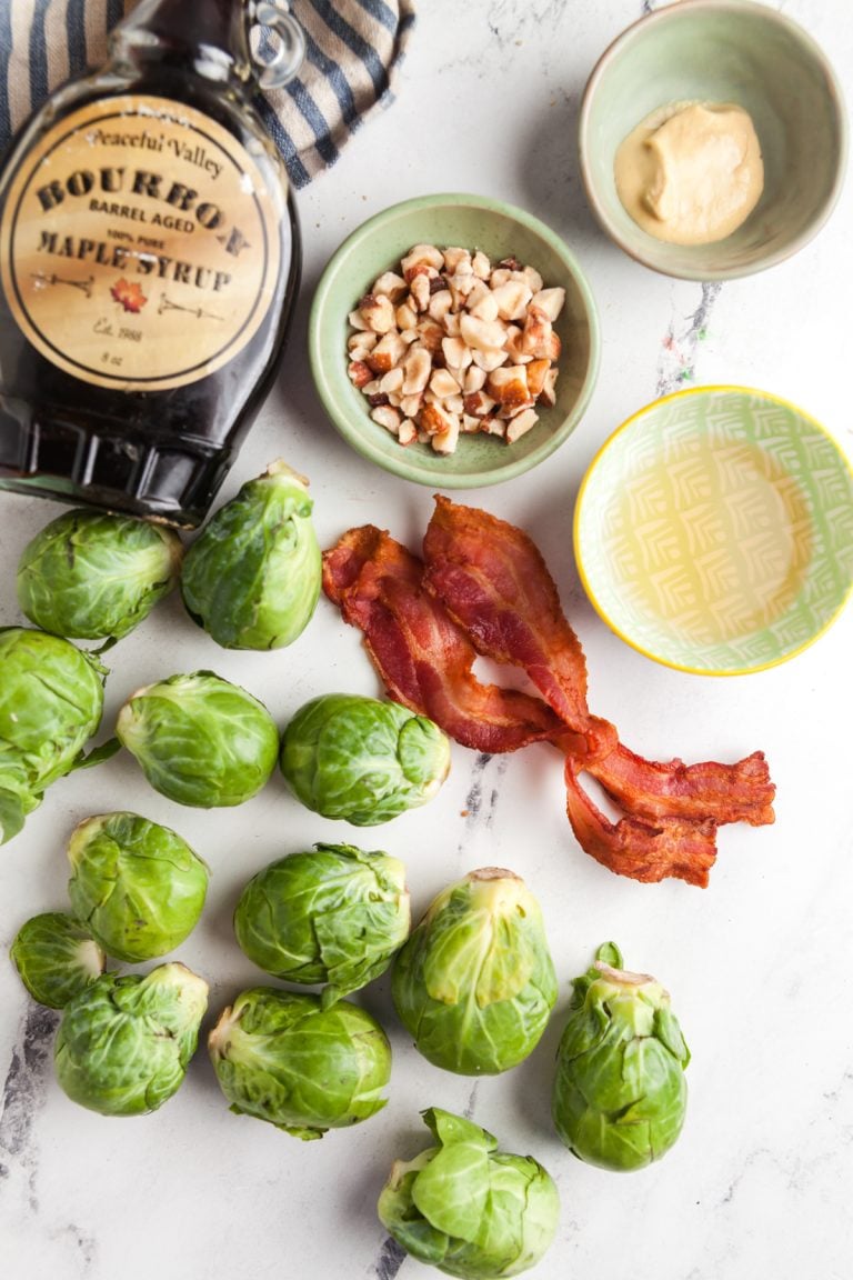 Overhead view of ingredients needed to make raw Brussels sprout salad with maple vinaigrette.