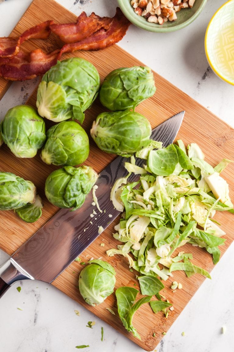 Use a sharp knife to shave Brussels sprouts for salad. 