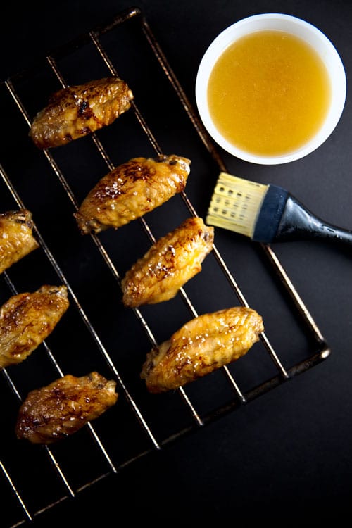 Crispy Baking Soda Chicken Wings with Margarita Glaze on a cooling rack. 