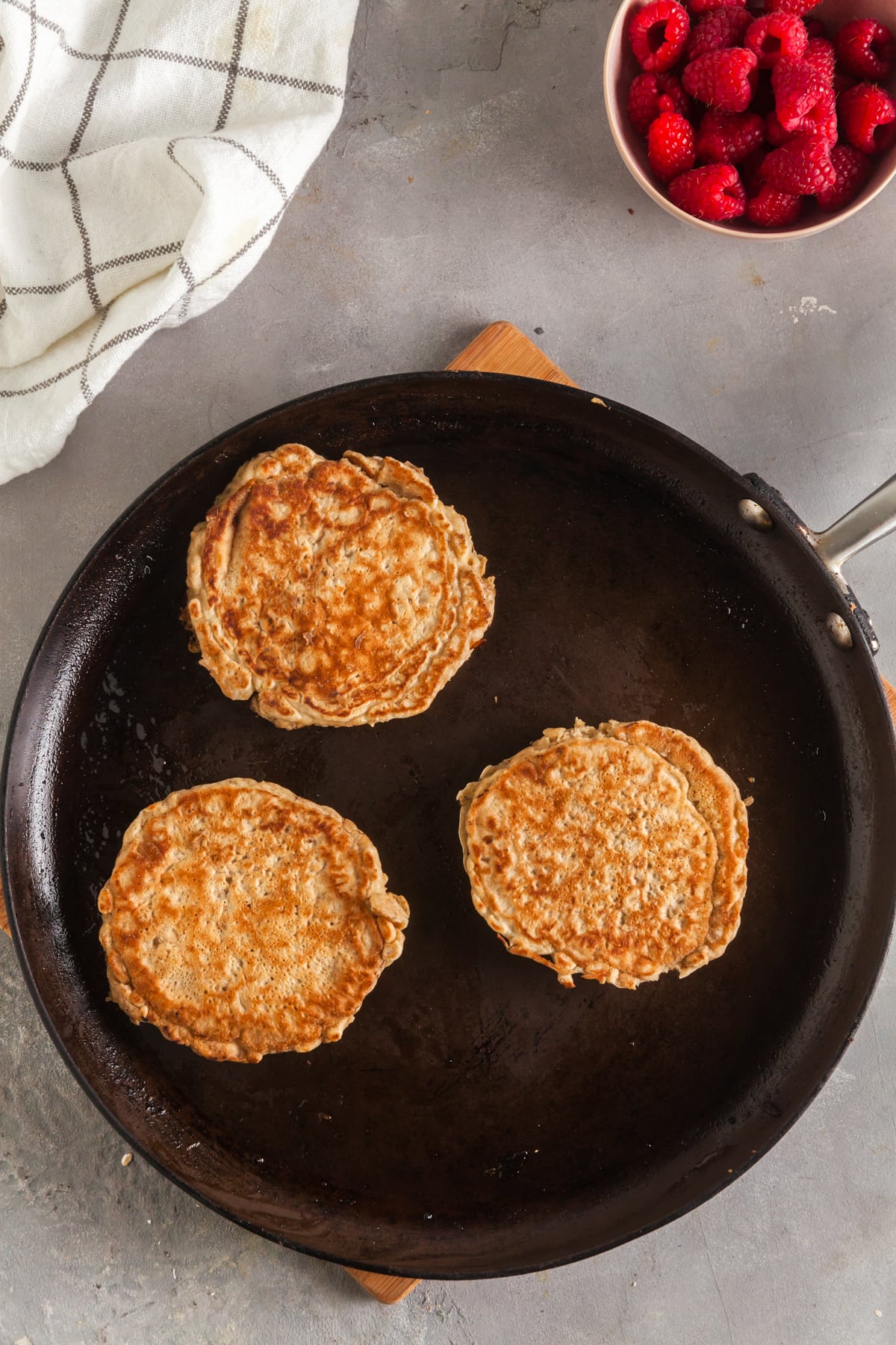 Oatmeal pancakes in a skillet. 
