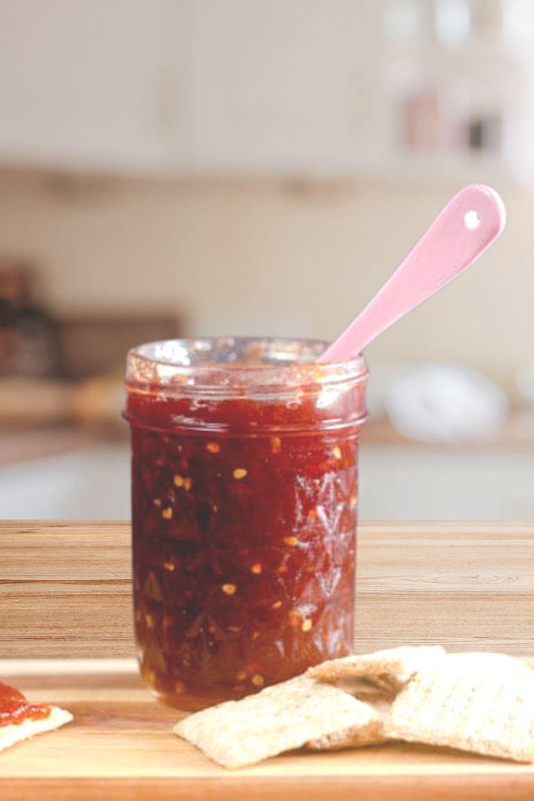 jar of tomato jam in a sunny kitchen