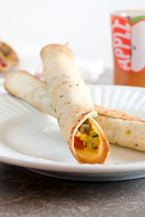 Sausage + Egg Baked Breakfast Taquitos // @HealthyDelish