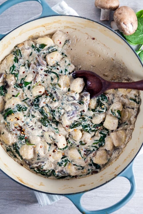 Baked Gnocchi in Tofu Cream Sauce with Spinach and Mushrooms | @HealthyDelish