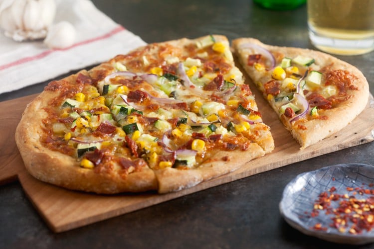 I've eaten a lot of pizza in my lifetime, but this chorizo pizza is hands-down my new favorite – and I don't say that casually. The combination of smokey chorizo, sweet corn, and zucchini is out-of-this-world good.