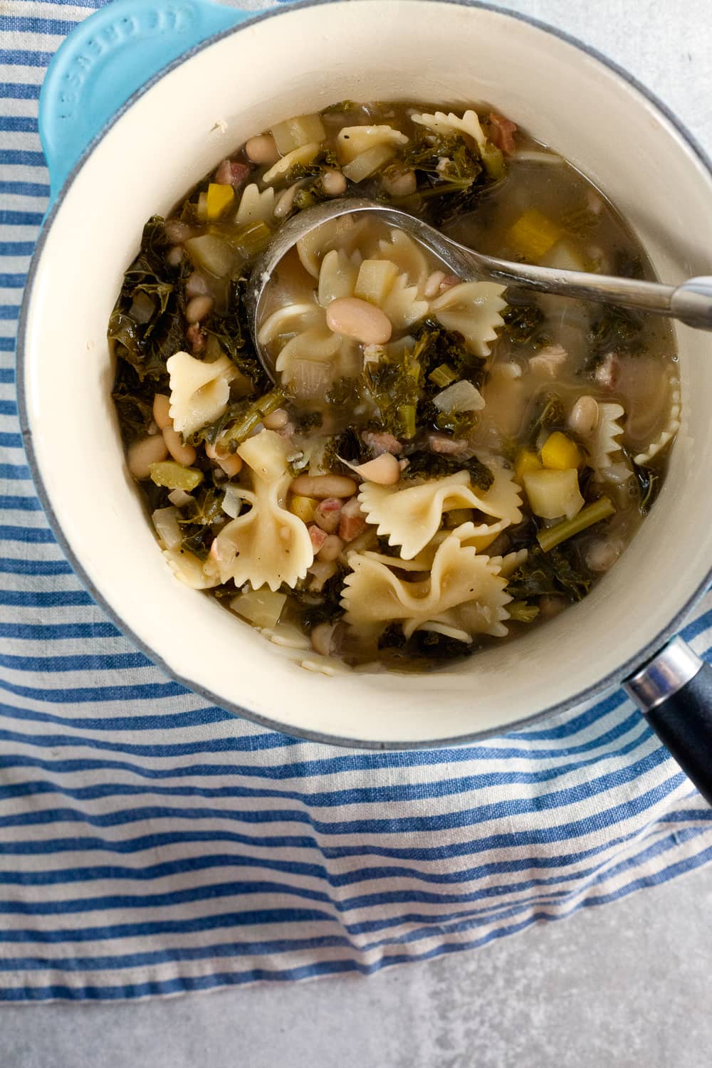 White bean and kale soup is the answer to your springtime cold. You’ll want to slurp it straight from the bowl!