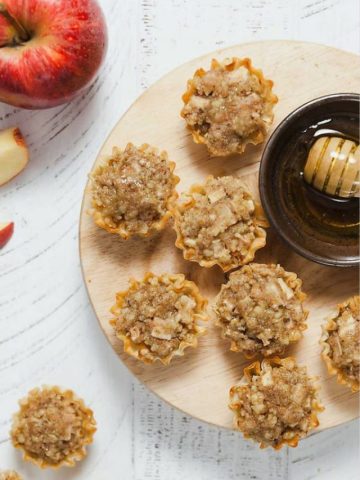 These easy baklava bites, filled with apples, walnuts, and honey, can be made in under 30 minutes! They make a great lunchbox surprise or after dinner treat.