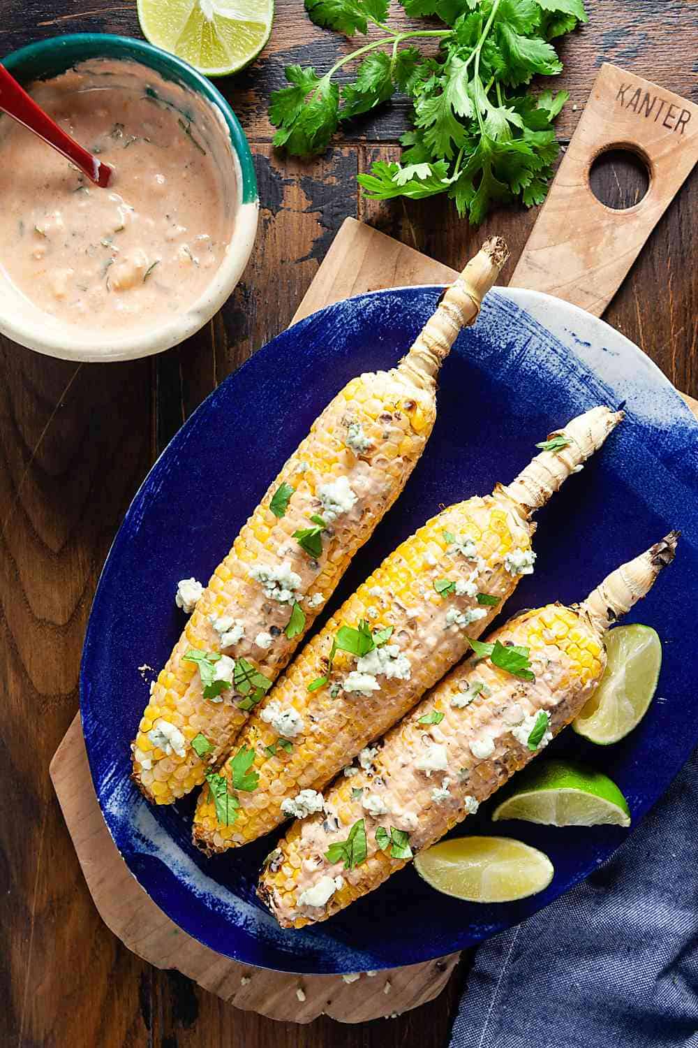 Dress up your grilled corn with a creamy mix of yogurt, wing sauce, and blue cheese for a summer side dish that’ll make your taste buds dance!
