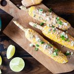 Dress up your grilled corn with a creamy mix of yogurt, wing sauce, and blue cheese for a summer side dish that’ll make your taste buds dance!