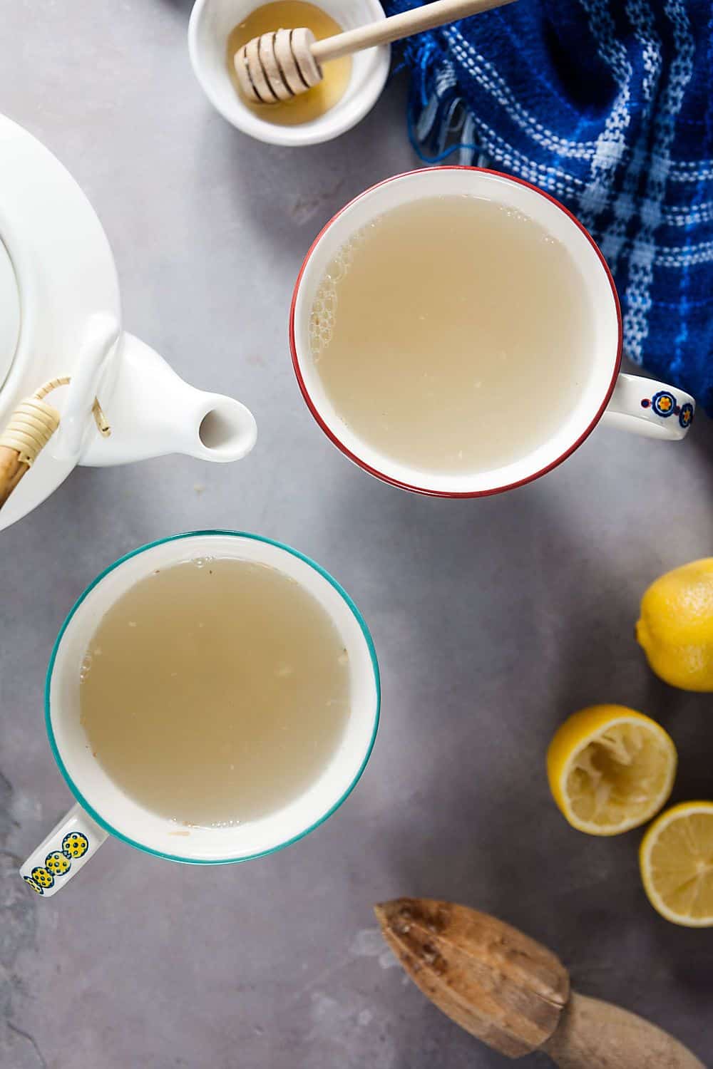 two cup of ginger lemon tea and a teapot
