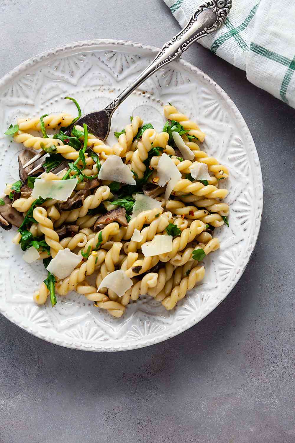 Gemelli with Mushrooms and Arugula on a plate