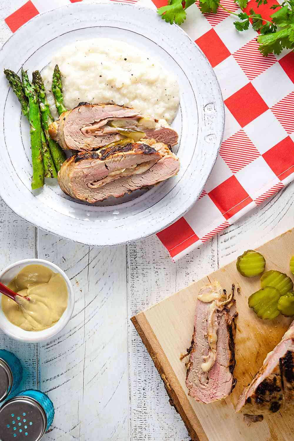 Sliced Cubano Stuffed Pork Loin on a picnic table