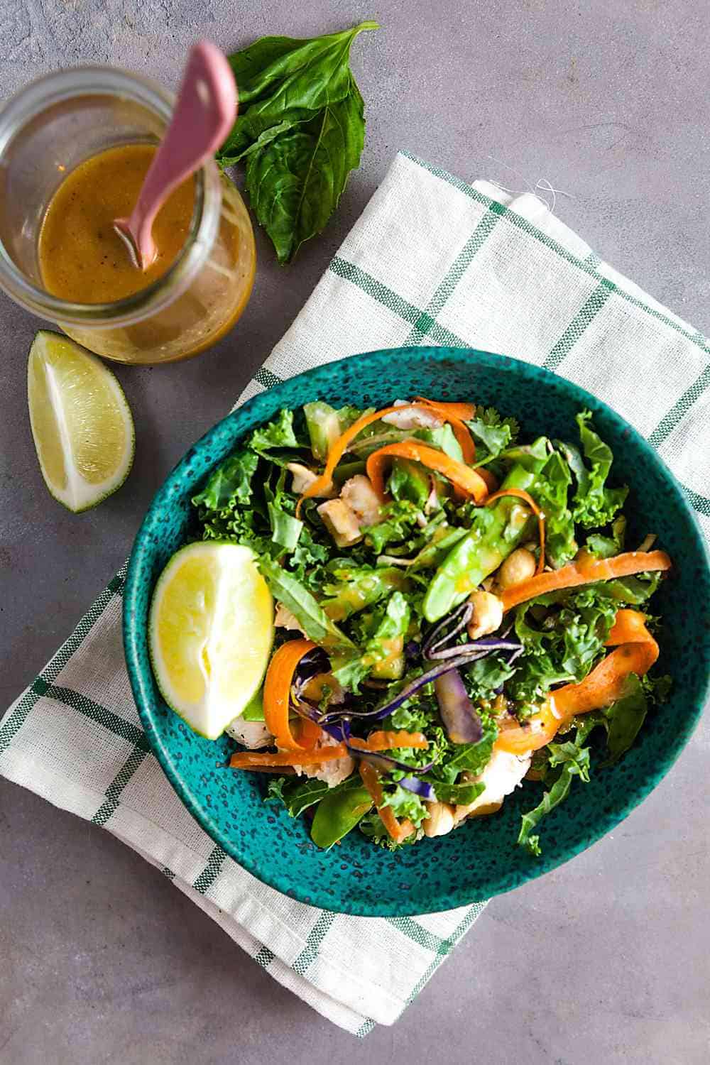 Thai chicken salad in a teal bowl 