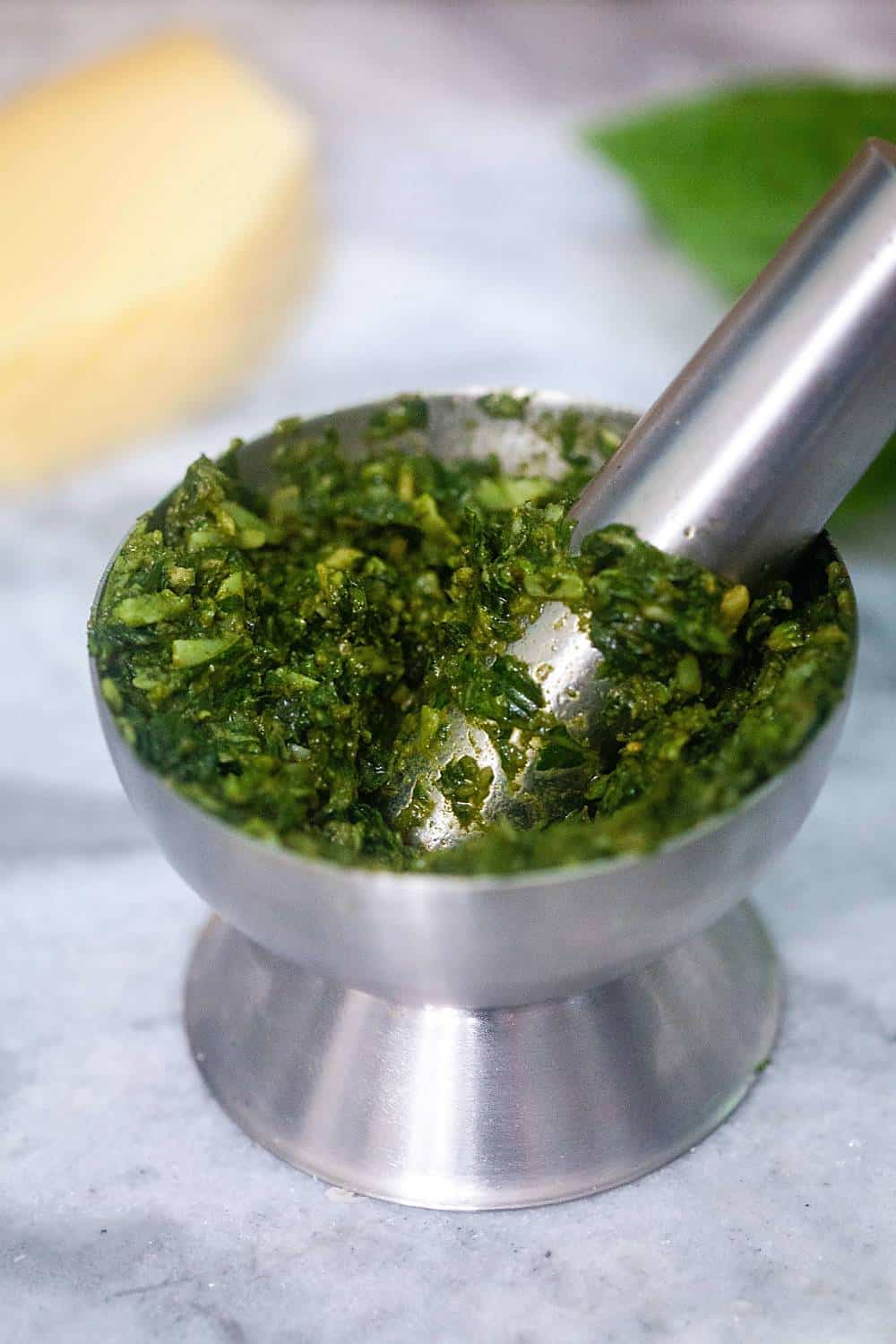 mortar and pestle with pesto