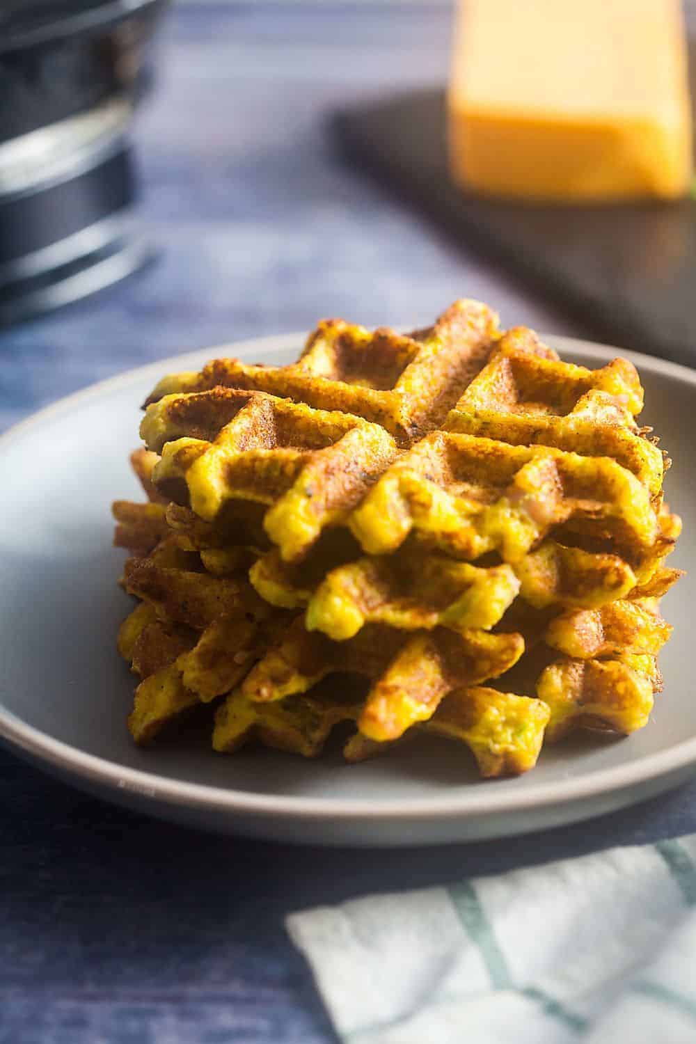 stack of savory low carb waffles with ham and cheddar