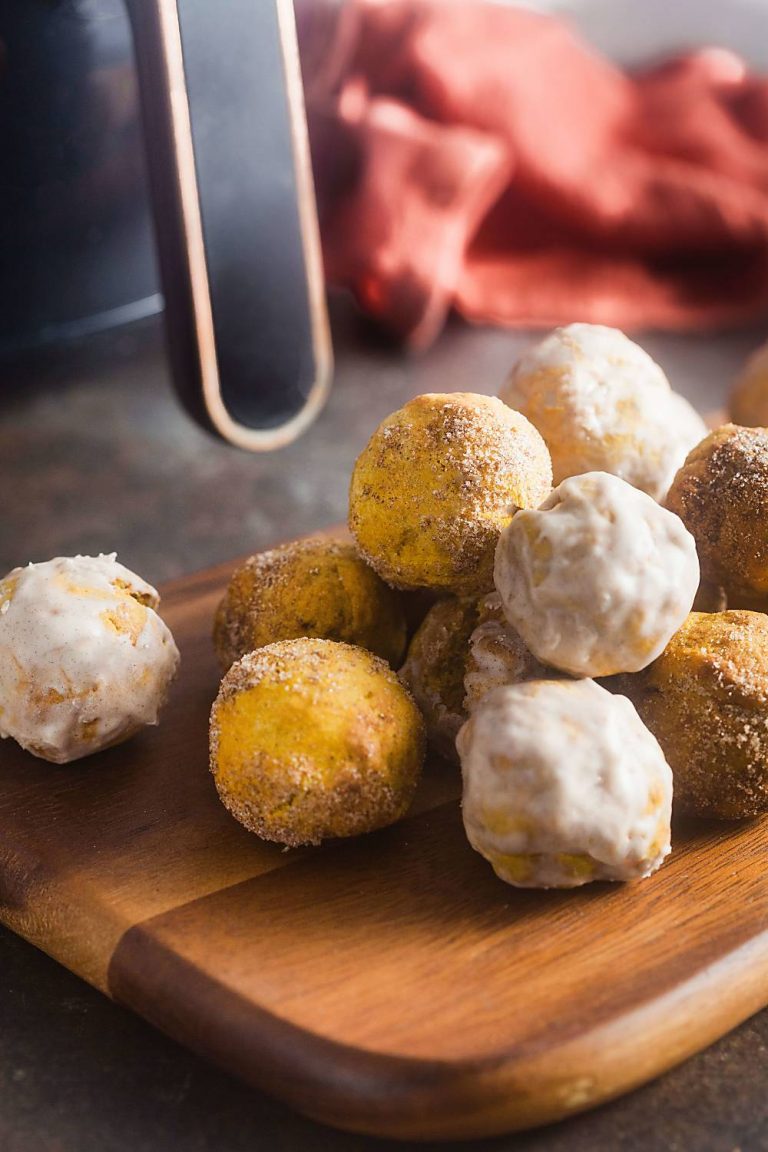air fried pumpkin spice donut holes on a wooden board