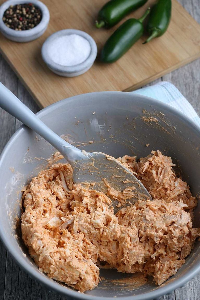 Mix the ingredients for spicy Buffalo chicken dip in a bowl