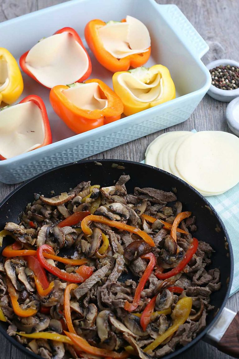 The first step is to cook the filling for our stuffed peppers, the peppers are waiting in a pan to be stuffed.