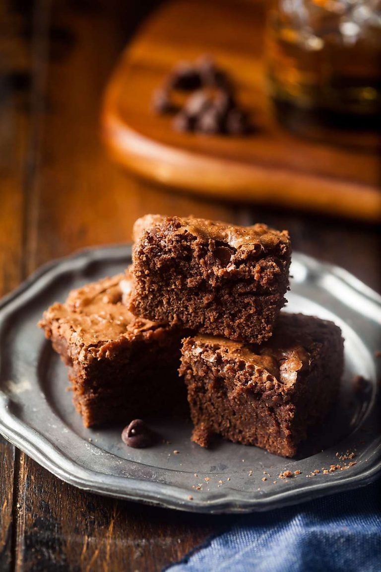 small plate stacked with fudgy brownies