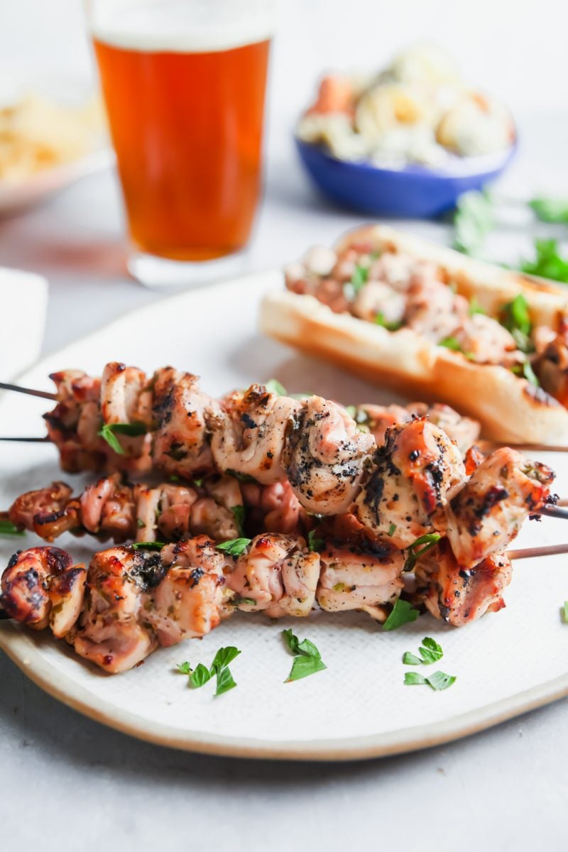 A platter of grilled chicken skewers