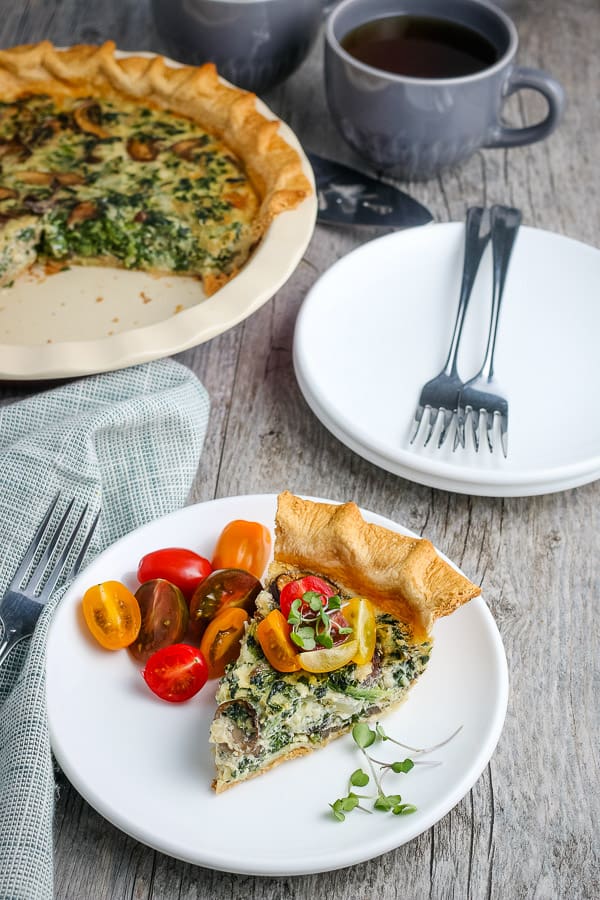 sliced spinach quiche on a plate