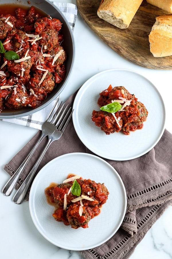 Two plates with homemade slow cooker meatballs