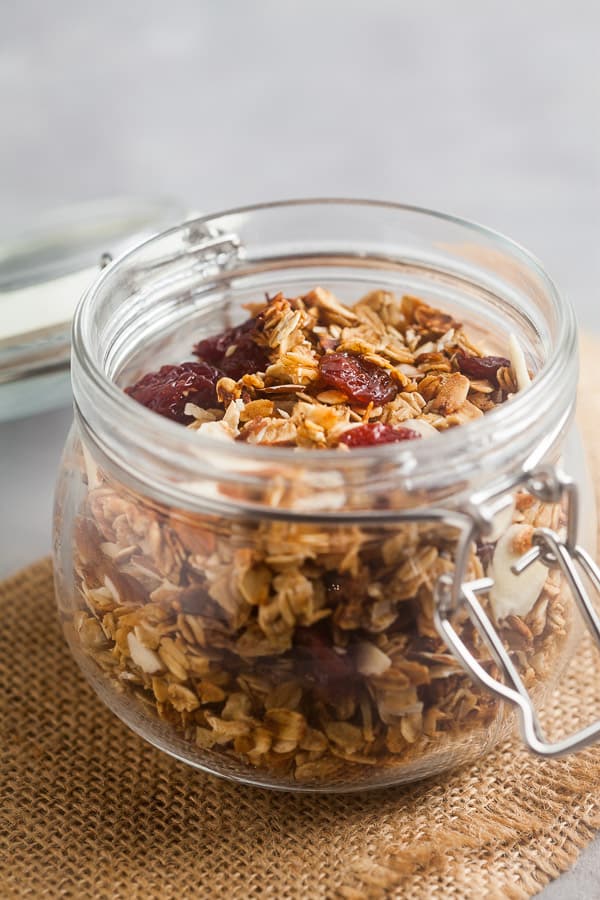 A pretty glass jar filled with homemade granols