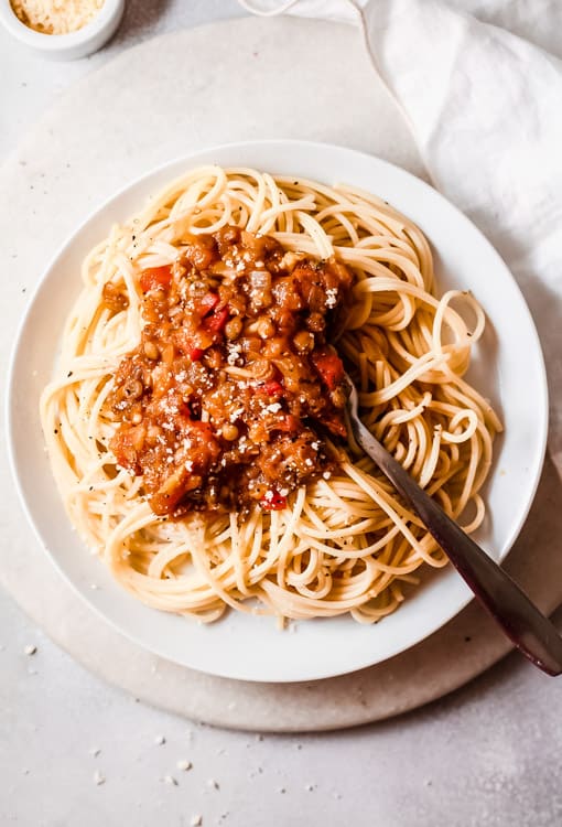 overhead view of a plate of spaghetti with vegetarian bolognese on top