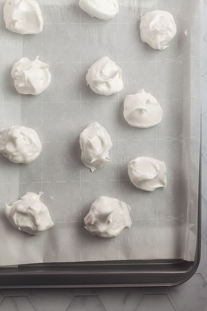 fluffy aquafaba meringue on a baking sheet