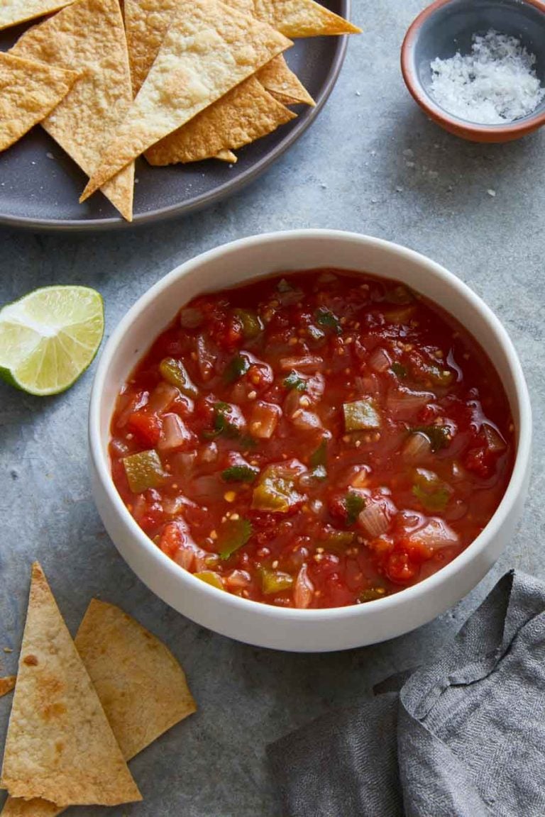 overhead view of restaurant style salsa from Clean Eating Instant Pot Cookbook, with chips in the background.