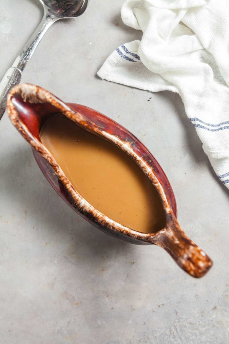 A gravy boat filled with vegetarian mushroom gravy, perfect for Thanksgiving!