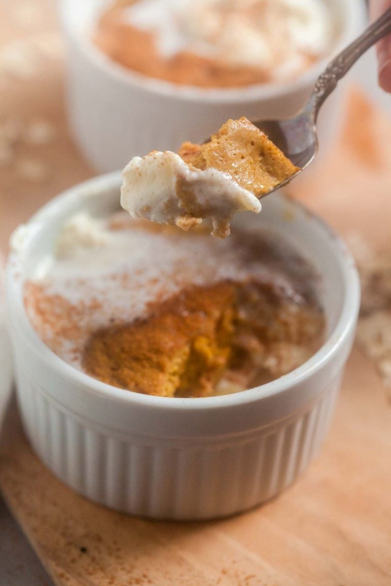 A closeup view of a spoonful of pumpkin spice latte baked oatmeal, to show the rich, custardy texture. 