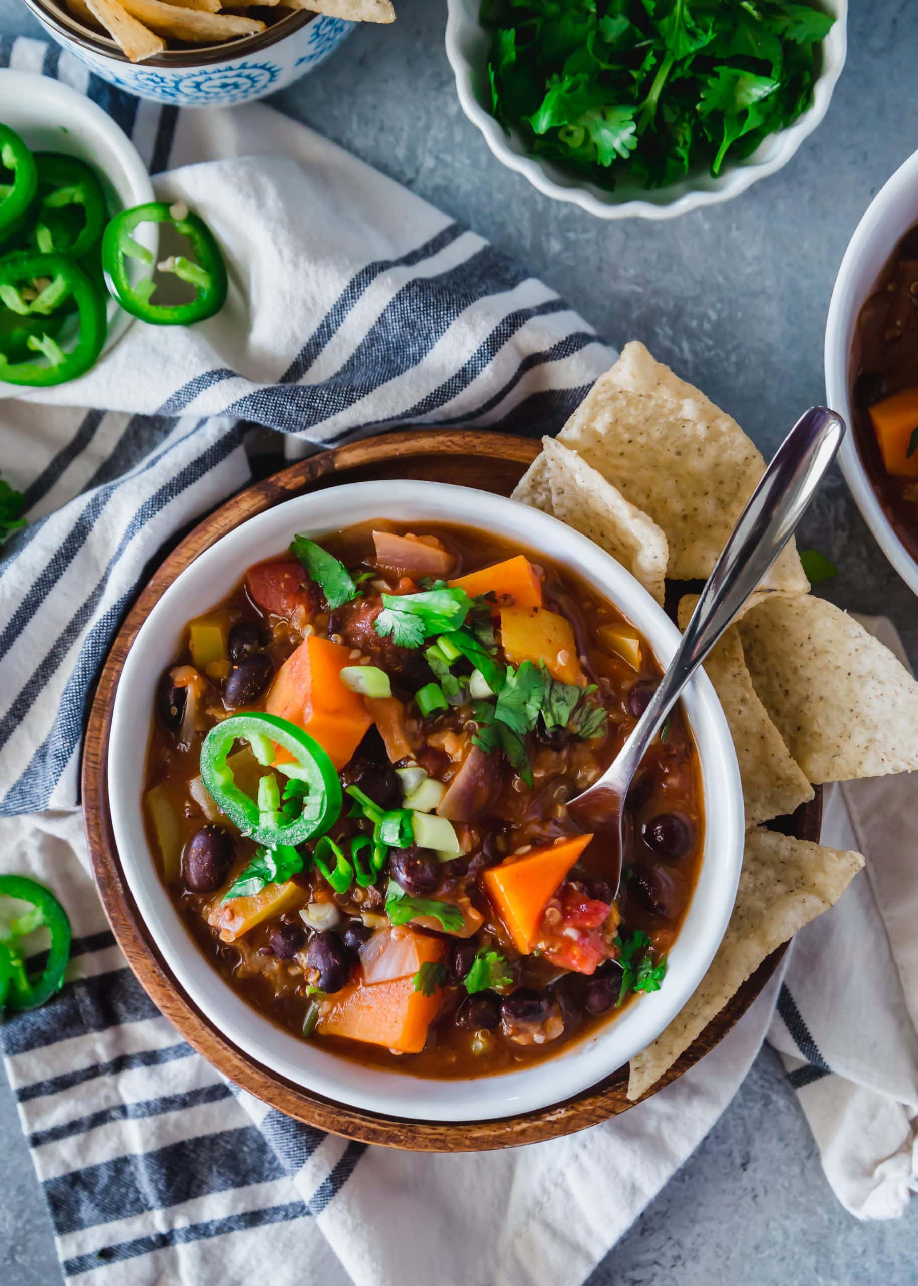 Overhead view of Sweet Potato Quinoa Chili with a side of tortilla chips.