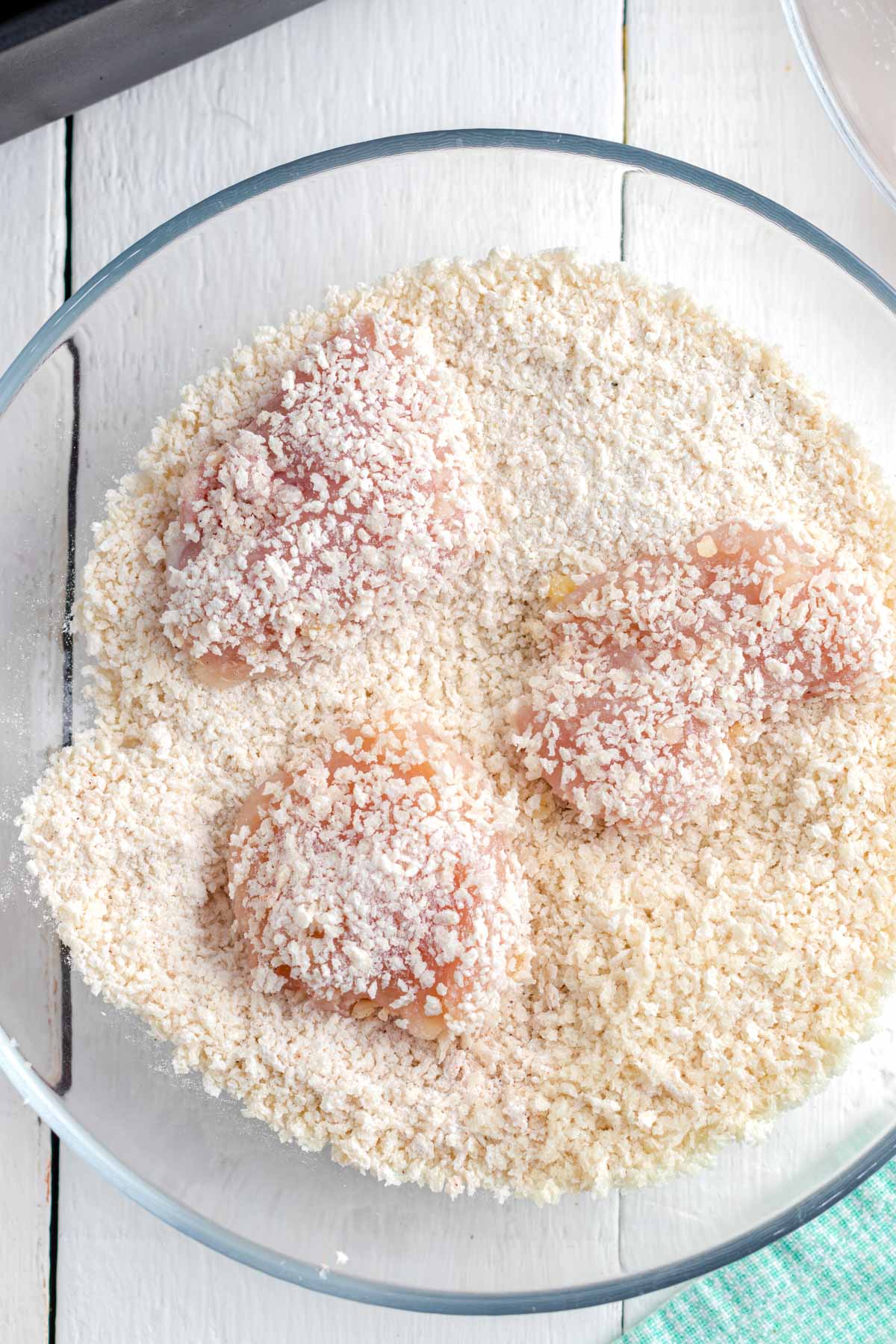 Coat the chicken nuggets thoroughly with seasoned panko before adding it to your air fryer.