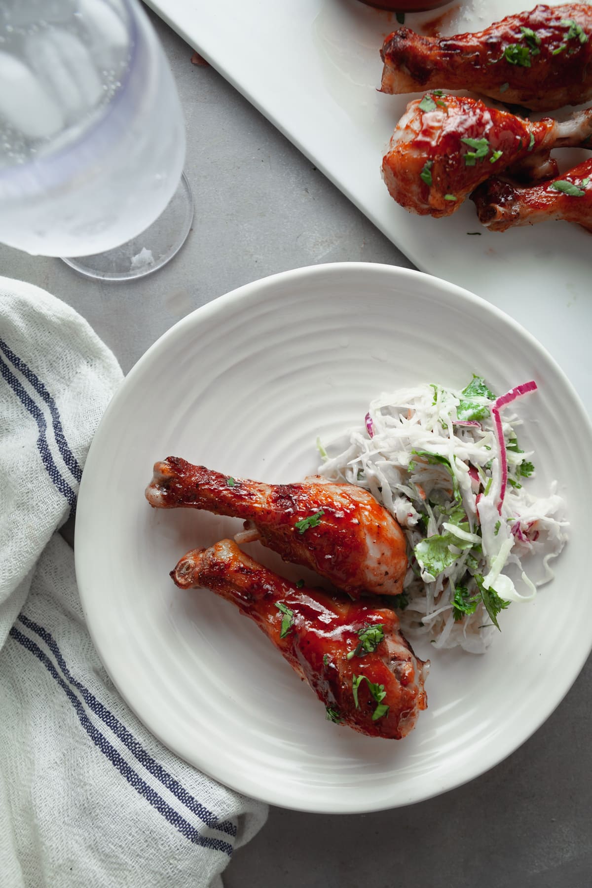 BBQ chicken legs and coleslaw. 