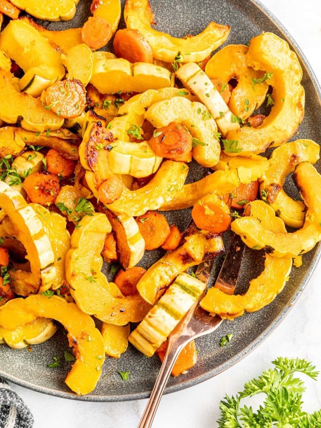 A platter of roasted squash and carrots in a miso and maple glaze.
