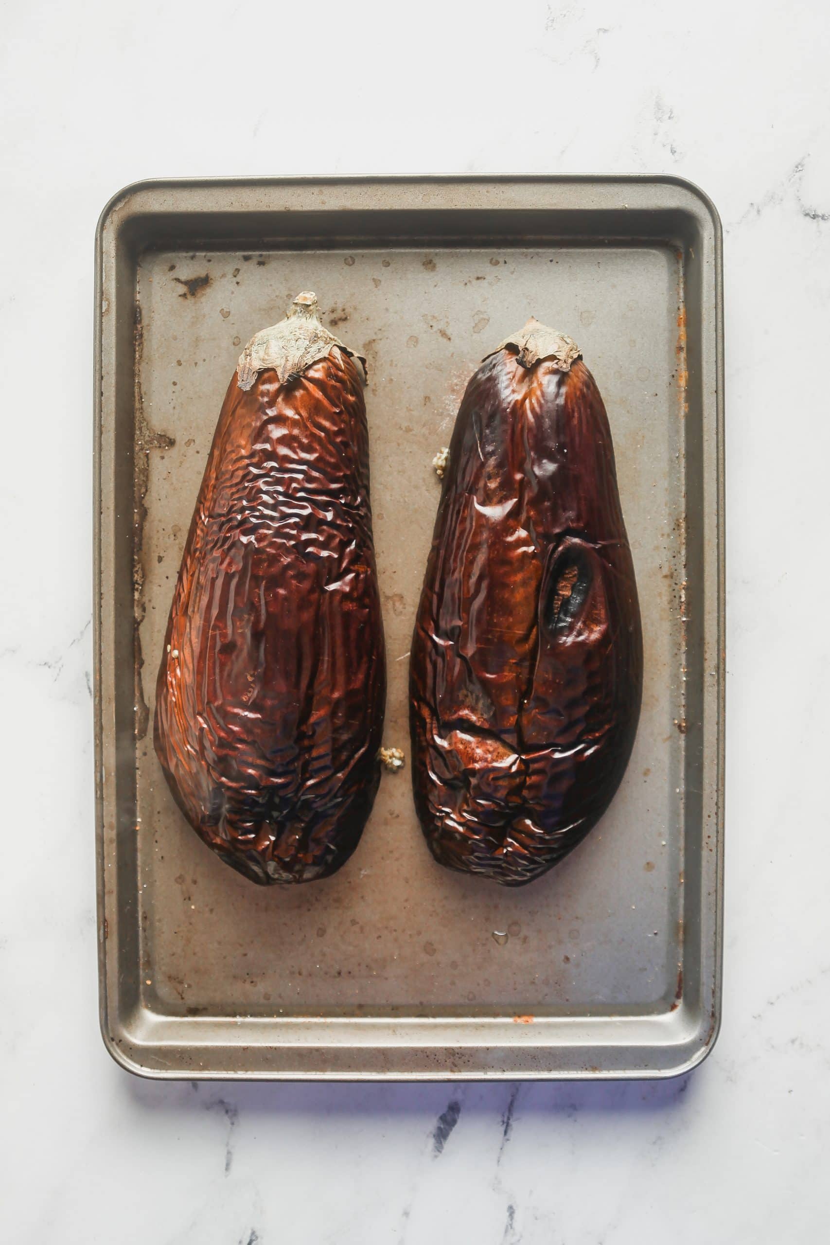 After the eggplant is charred. 