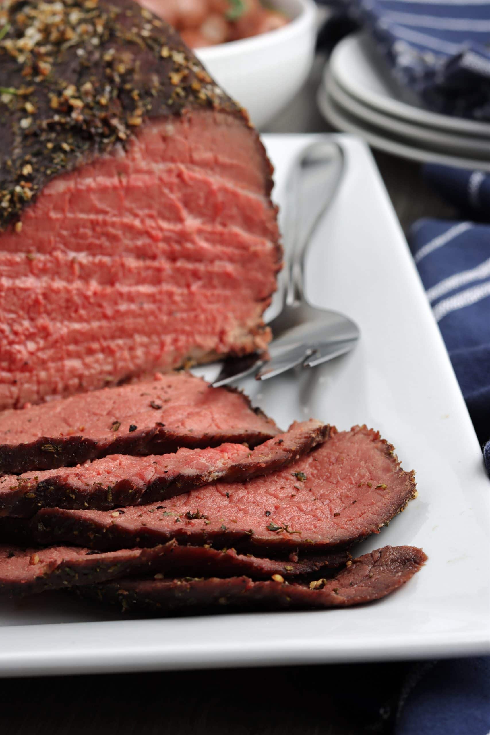 Closeup image of thinly sliced roast beef. 