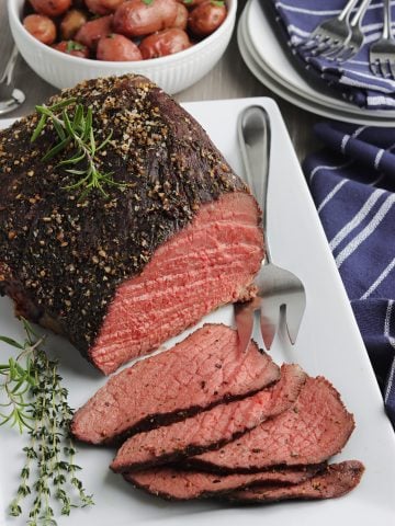 Roast beef on a serving platter.