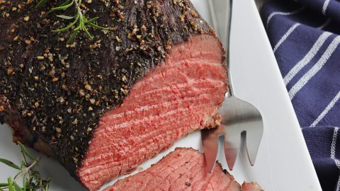 Roast beef on a serving platter.