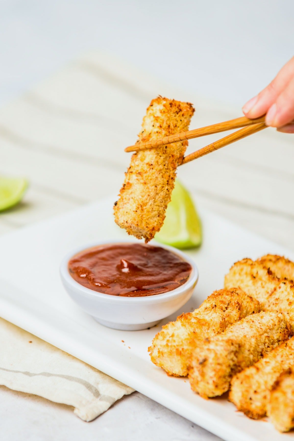 Dipping tofu katsu into homemade sauce. 