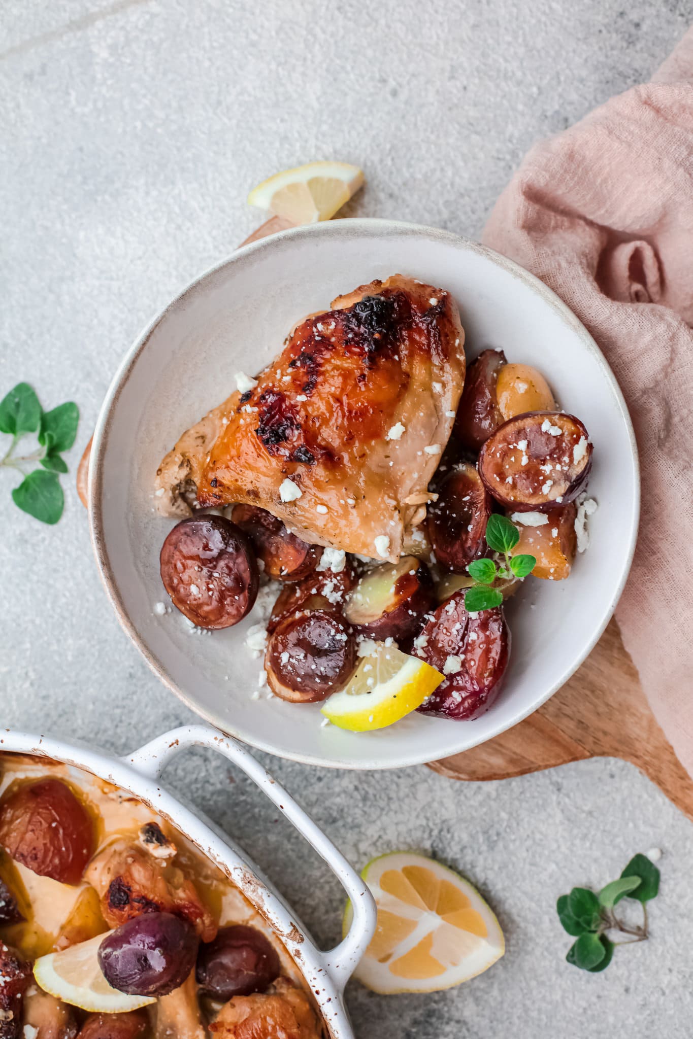 Overhead view of a dish of one pan Greek chicken and potatoes. 