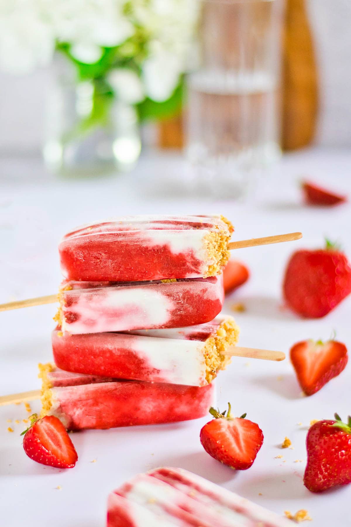 A stack of strawberry coconut ice pops. 