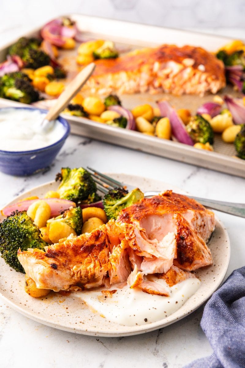 Flaky salmon with roast broccoli and gnocchi, served with hot honey yogurt sauce.